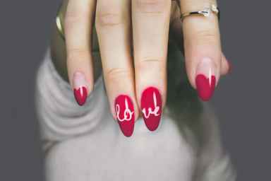 red and white manicure with love print